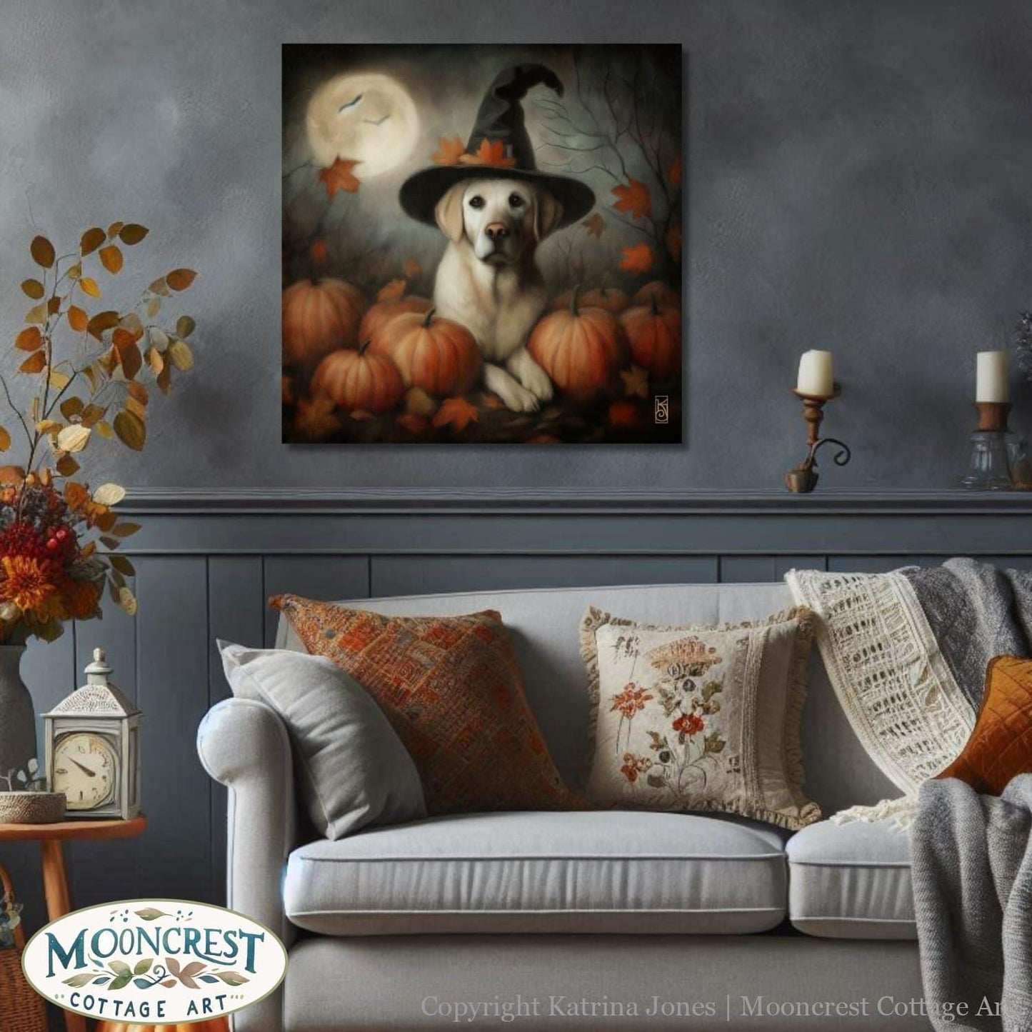 a dog wearing a witches hat sitting on a couch