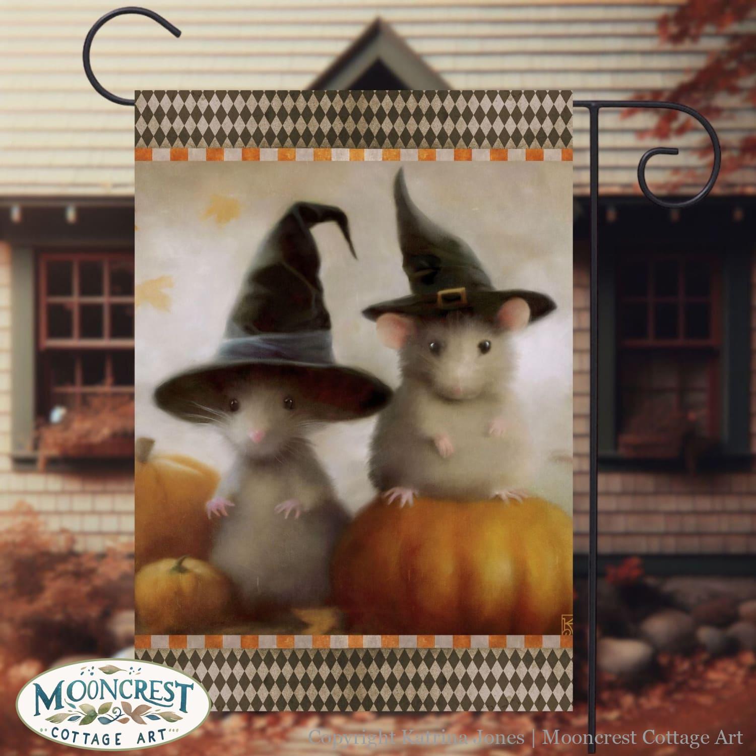 a picture of two mice dressed up as witches