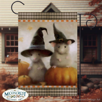 a picture of two mice dressed up as witches