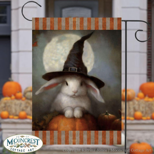 a painting of a rabbit wearing a witches hat