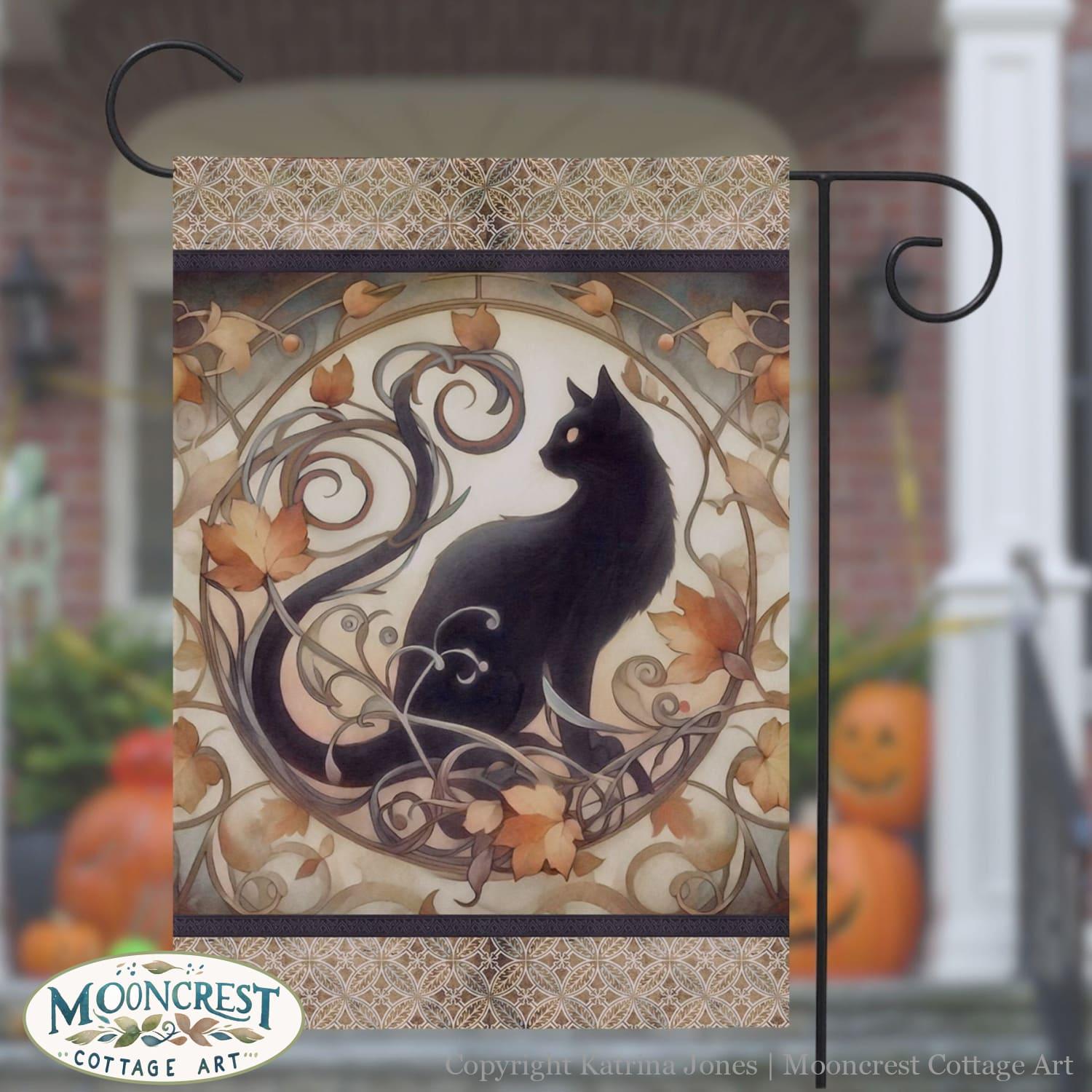 a black cat sitting on top of a metal pole