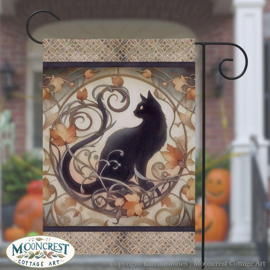 a black cat sitting on top of a metal pole
