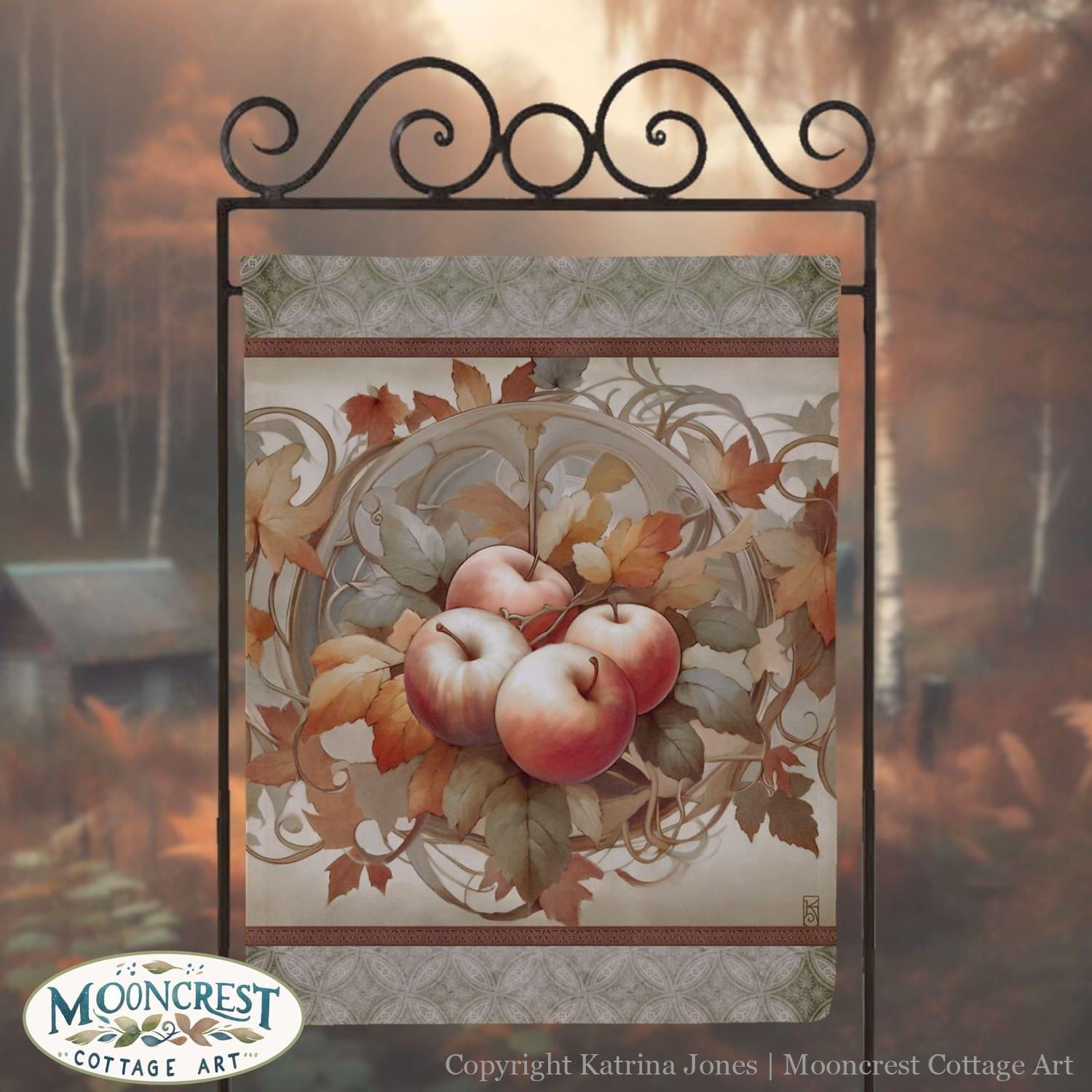a picture of apples hanging on a metal frame